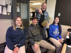 Cate, Aaron, and Sophia from Xavier (and the pineapple)